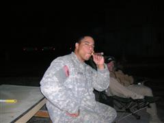 PO2 Cordero at the fire pit in Kunduz, Afghanistan
