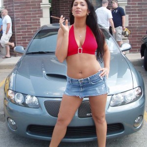 The Outlaw Cigar Girl in front of the GTO