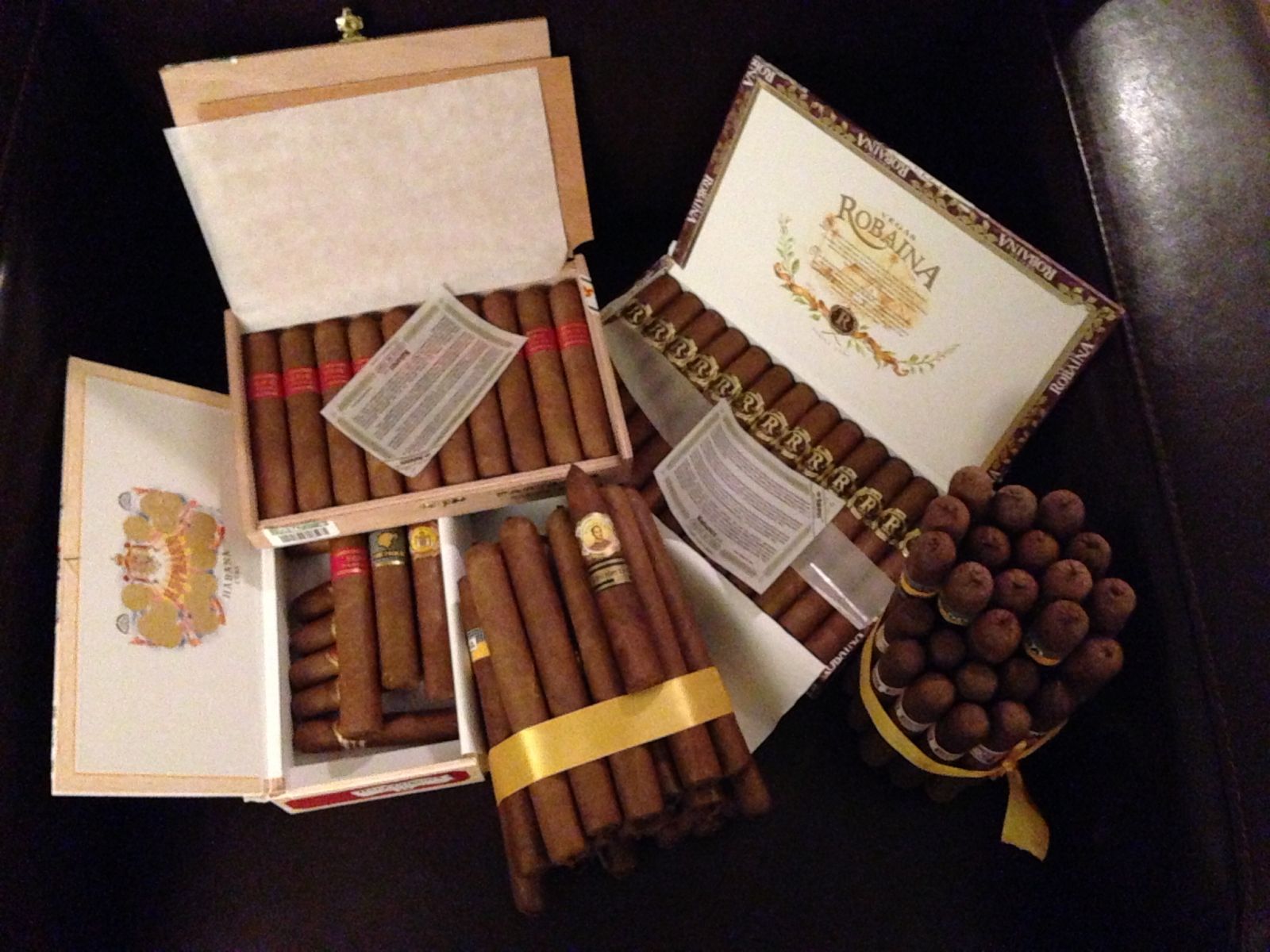 50 custom rolled cigars of different vitolas of tobacco directly from San Luis, Pinar del Rio. 2012 Robainas, 2009 PSD4, box of assorted other cubans.