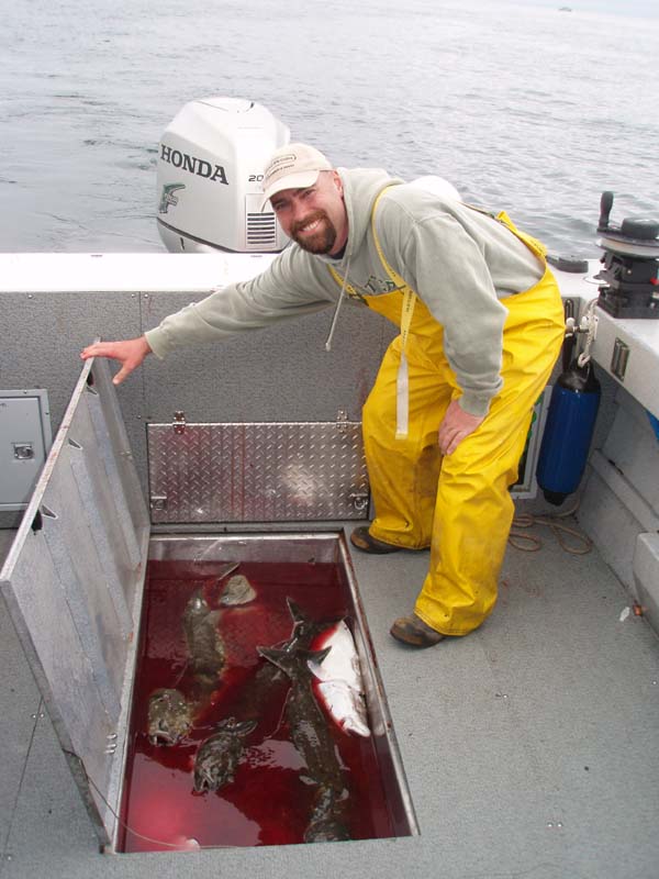 Cory.with.our.Halibut.catch.jpg
