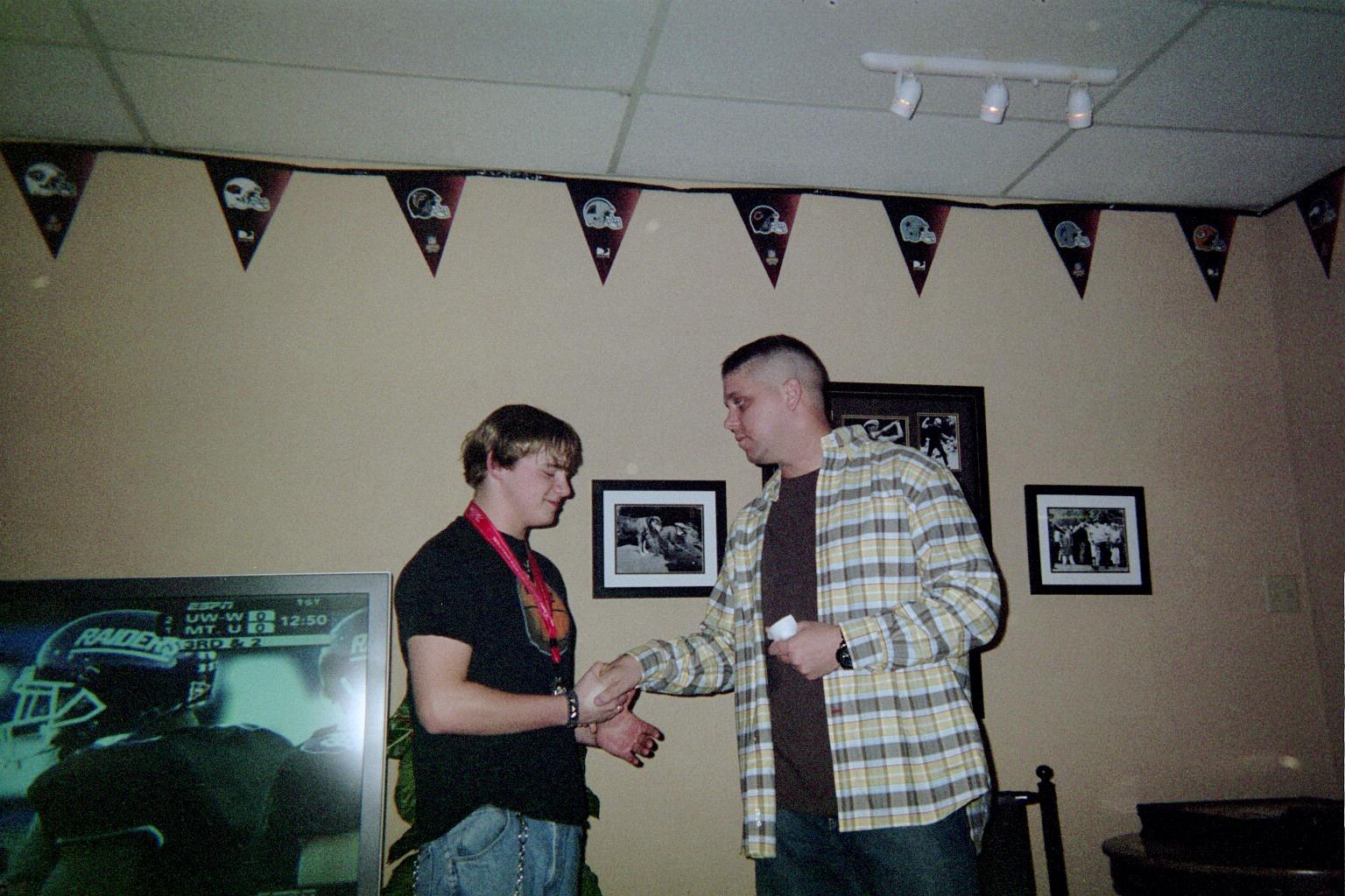 Wyatt presents Matt with a Unit Coin